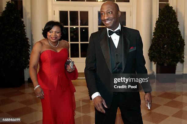 Kenneth Frazier, president and chief executive officer of Merck and Co., right, and Andrea Frazier arrive to a state dinner hosted by U.S. President...