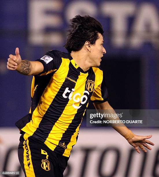 Guarani's Federico Santander celebrates after scoring against Racing during their Libertadores Cup football match at the Defensores del Chaco stadium...