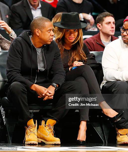 Musicians Jay-Z and Beyonce attend a game between the Brooklyn Nets and the Houston Rockets at Barclays Center on January 12, 2015 in the Brooklyn...