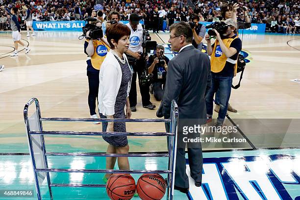 Head coach Muffet McGraw of the Notre Dame Fighting Irish and head coach Geno Auriemma of the Connecticut Huskies meet prior to the start of the NCAA...