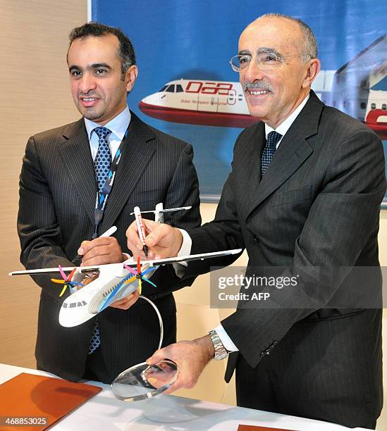 Khalifa AlDaboos , managing director of Dubai Aerospace and ATR chief executive Filippo Bagnato pose after a signing ceremony during the Singapore...