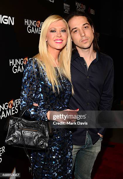 Actress Tara Reid and Erez Eisen attend the 'The Hungover Games' cast & crew screening at TCL Chinese 6 Theatres on February 11, 2014 in Hollywood,...