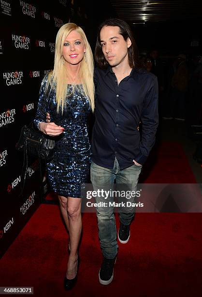 Actress Tara Reid and Erez Eisen attend the 'The Hungover Games' cast & crew screening at TCL Chinese 6 Theatres on February 11, 2014 in Hollywood,...