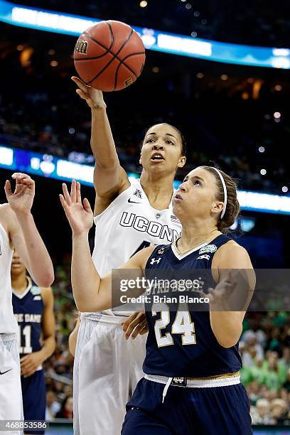 Hannah Huffman of the Notre Dame Fighting Irish and Kiah Stokes of the Connecticut Huskies battle for a rebound during the NCAA Women's Final Four...