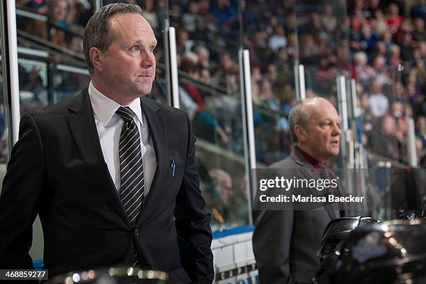 Head coach Dave Lowry of the Victoria Royals stands on the bench against the Kelowna Rocketson February 8, 2014 at Prospera Place in Kelowna, British...