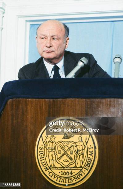 American politician and New York Mayor Ed Koch stares out from behind a lectern during an unspecified press conference, New York, New York, February...