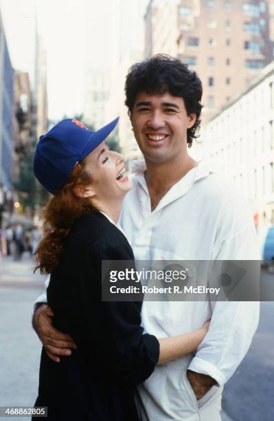 Portrait of American baseball player Ron Darling, a pitcher for the New York Mets, as he poses with his wife, model and actress Toni Darling , New...
