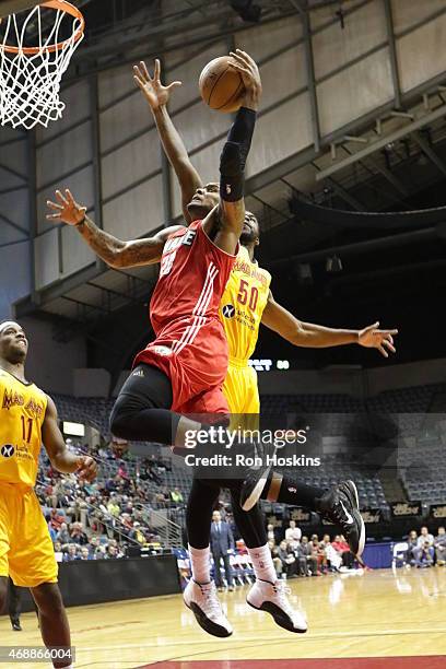 Romero Osby of the Maine Red Claws lays the ball up on a Mad Ants defender during their NBDL game at Memorial Coliseum April 7, 2015 in Fort Wayne,...