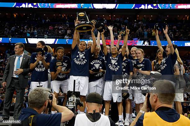 The Connecticut Huskies celebrate on stage after defeating the Notre Dame Fighting Irish 63-53 during the NCAA Women's Final Four National...