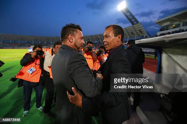Antonio Mohamed coach of Monterrey and Jose Guadalupe Cruz coach of Puebla greet prior a semifinal match between Puebla and Monterrey as part of...