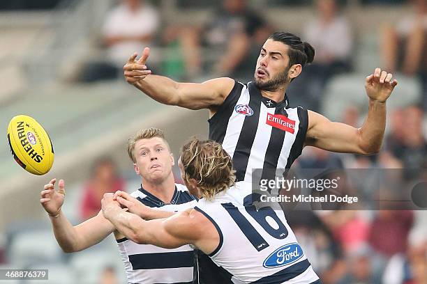 Brodie Grundy of the Magpies and Dawson Simpson of the Cats contest for the ball during the round one AFL NAB Cup match between the Geelong Cats and...