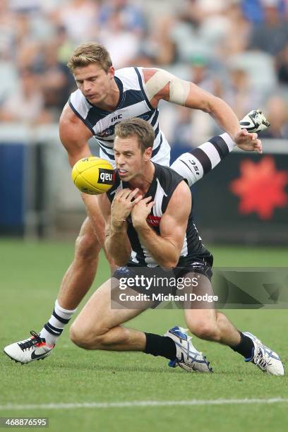 Nick Maxwell of the Magpies and Nathan Vardy of the Cats contest for the ball during the round one AFL NAB Cup match between the Geelong Cats and the...