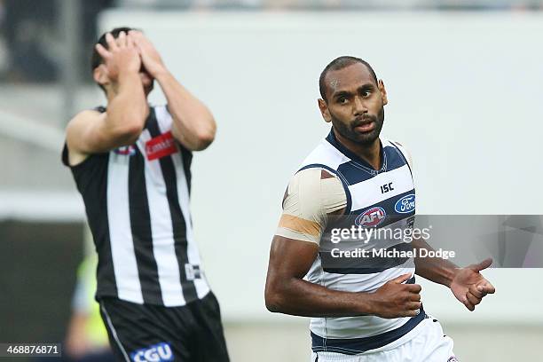 Martin Clarke of the Magpies as Travis Varcoe of the Cats celebrates a goal during the round one AFL NAB Cup match between the Geelong Cats and the...