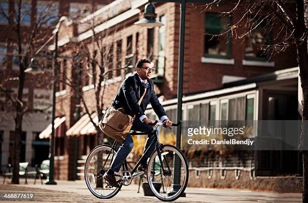 urban cyclist - denver stock pictures, royalty-free photos & images