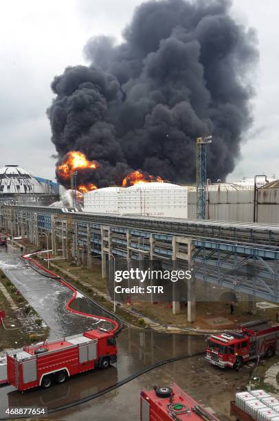 Firefighters battle a blaze following an explosion at a plant producing paraxylene - a chemical commonly known as PX - in Zhangzhou, east China's...