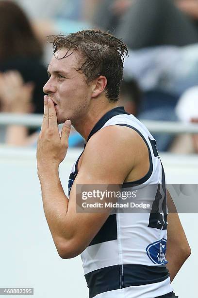 Mitch Duncan of the Cats blows a kiss to celebrate a goal during the round one AFL NAB Cup match between the Geelong Cats and the Collingwood Magpies...