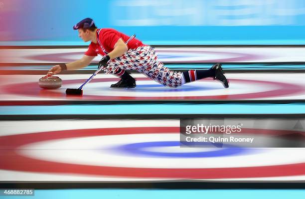 Christoffer Svae of Norway slides with the stone during Curling Men's Round Robin match between Norway and Germany during day five of the Sochi 2014...