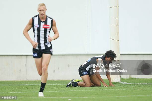 Tony Armstrong of the Magpies reacts after receiving a heavy bump during the round one AFL NAB Cup match between the Geelong Cats and the Collingwood...
