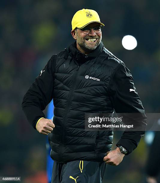 Head coach Juergen Klopp of Dortmund celebrates with the fans after the DFB Cup Quarter Final match between Borussia Dortmund and 1899 Hoffenheim at...