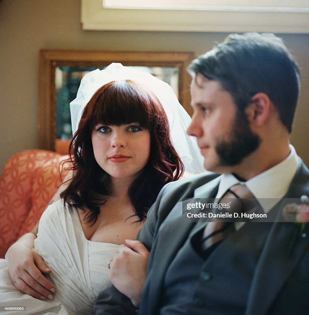 Bride And Groom Resting On Couch