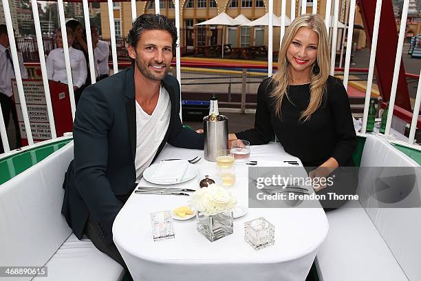 Tim Robards and Anna Heinrich pose inside a ferris wheel cabin during Luna Park's 2014 Valentine's event at Luna Park on February 12, 2014 in Sydney,...