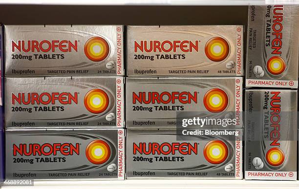 Packets of Nurofen ibuprofen pain relief tablets, produced by Reckitt Benckiser Group Plc, sit displayed for sale inside a supermarket in London,...