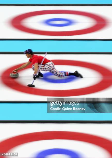 Thomas Ulsrud of Norway slides with the stone during Curling Men's Round Robin match between Norway and Germany during day five of the Sochi 2014...