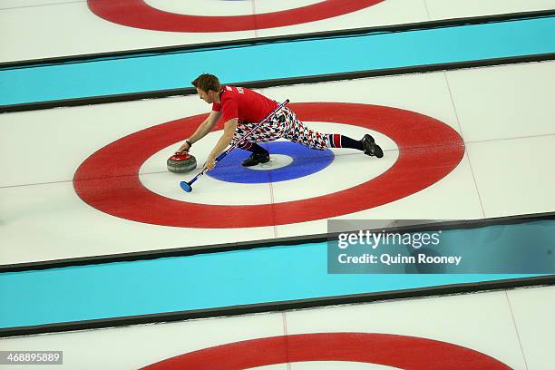 Torger Nergaard of Norway slides with the stone during Curling Men's Round Robin match between Norway and Germany during day five of the Sochi 2014...