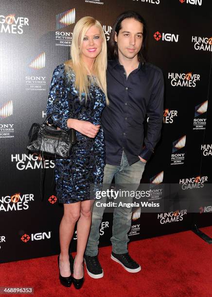 Actress Tara Reid and Erez Eisen attend the premiere of Sony Pictures Home Entertainment's "The Hungover Games" at TCL Chinese 6 Theatres on February...