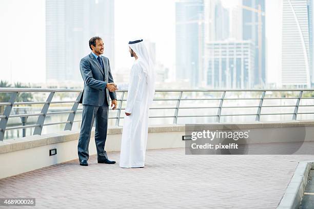 business partnership in dubai - united arab emirates stock pictures, royalty-free photos & images