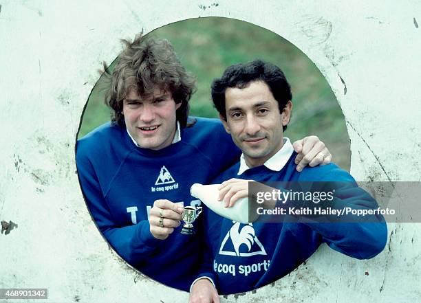 League Cup Final media day at Tottenham Hotspur, with Spurs' Osvaldo Ardiles pouring milk into a miniature trophy being held by Glenn Hoddle, circa...