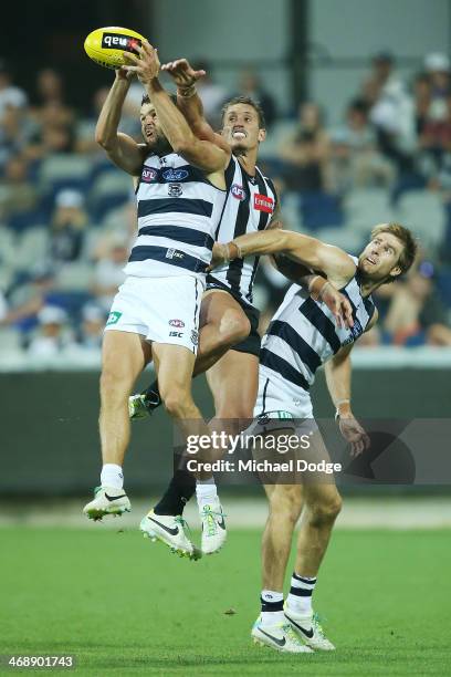 Jared Rivers of the Cats marks the ball against Jesse White of the Magpies during the round one AFL NAB Cup match between the Geelong Cats and the...