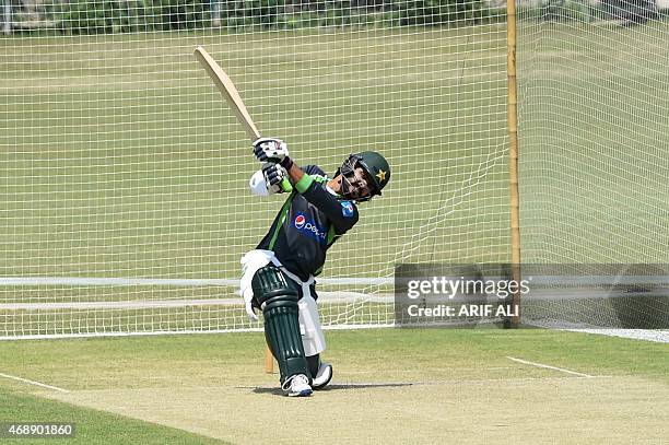 Pakistani cricketer Fawad Alam plays a shot during a training camp for the upcoming Bangladesh cricket tour at the Gaddafi Stadium in Lahore on April...