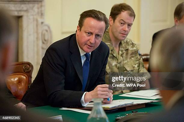 Britain's Prime Minister David Cameron speaks during a Cobra meeting at Number 10 Downing Street on February 12, 2014 in London, England. Following...