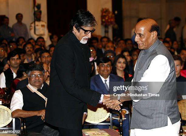 Home Minister Rajnath Singh greets Film actor Amitabh Bachchan before he received Padma Vibhushan award from President Pranab Mukherjee during the...