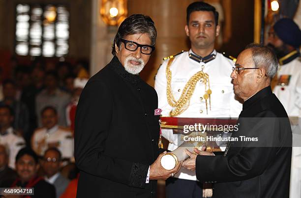 President Pranab Mukherjee presenting the Padma Vibhushan award to Film actor Amitabh Bachchan during the Padma awards ceremony at Rashtrapti Bhawan...