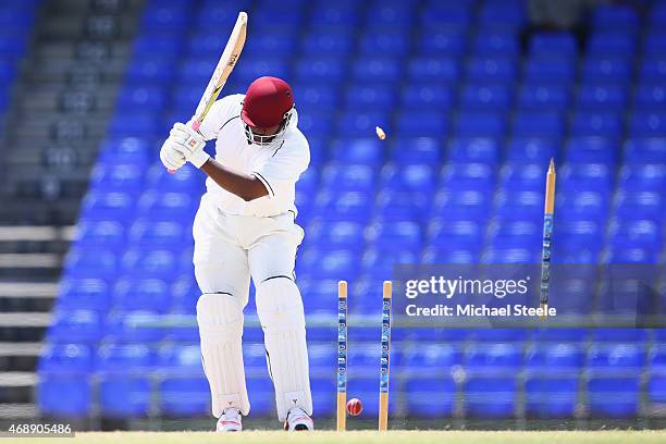 Shane Jeffers of St Kitts is bowled by Ben Stokes of England during day one of the 2nd Invitational Warm Up match between St Kitts and Nevis and...