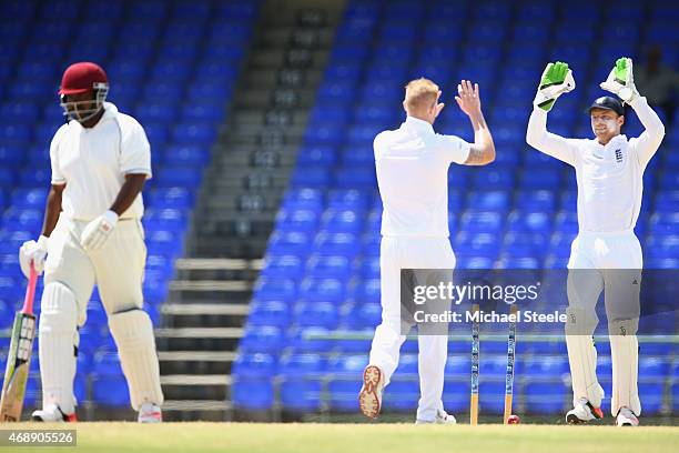 Ben Stokes of England is congratulated by wicketkeeper Jos Buttler after clean bowling Shane Jeffers of St Kitts during day one of the 2nd...