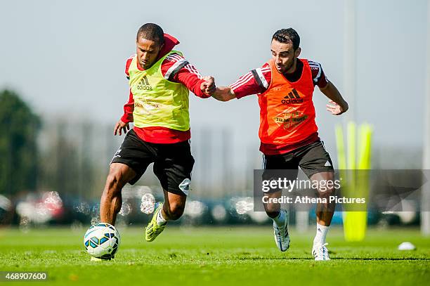 Wayne Routledge and Leon Britton of Swansea City in action during the Swansea City training session at the Fairwood Training Centre on April 07, 2015...