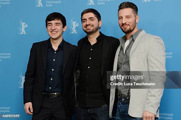 Actor Alechan Tagaev, director Umut Dag and actor Murathan Muslu attend the 'Cracks in Concrete' photocall during 64th Berlinale International Film...