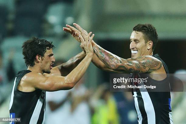 Jesse White of the Magpies celebrates his goal with Scott Pendlebury during the round one AFL NAB Cup match between the Geelong Cats and the...