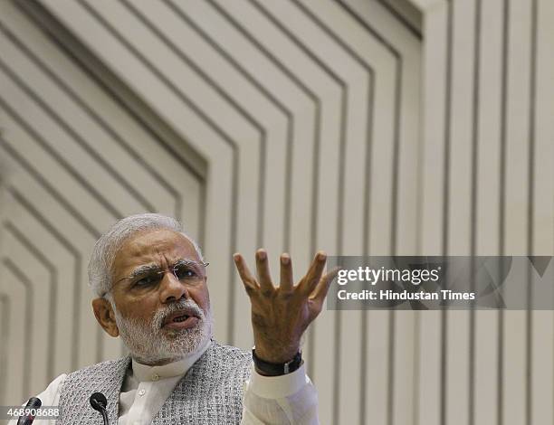 Prime Minister Narendra Modi address the gathering during the launch of the Pradhan Mantri MUDRA Yojana at Vigyan Bhawan on April 8, 2015 in New...