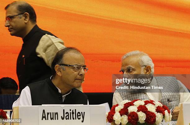 Prime Minister Narendra Modi with Union Minister for Finance Arun Jaitley and MOS Jayant Sinha during the launch of the Pradhan Mantri MUDRA Yojana...