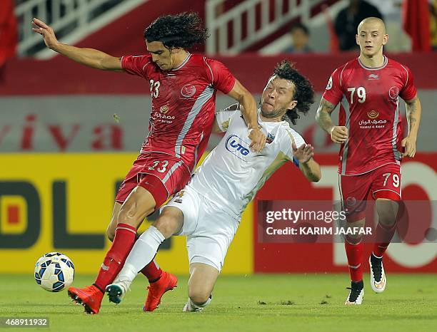 Qatar Lekhwiya's forward Sebastian Soria is challenged by Uzbekistan Bunyodkor's defender Hayrulla Karimov during their AFC Champions League group A...