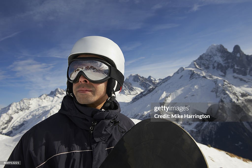 Male Snowboarder Looking over Chamonix, Mont Blanc