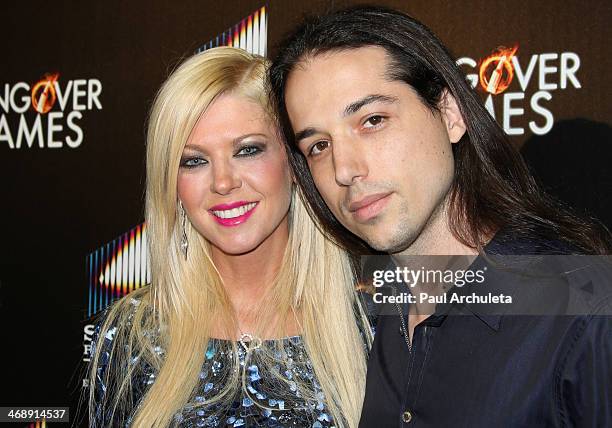 Actress Tara Reid and Recording Artist Erez Eisen attend the "The Hungover Games" premiere at the TCL Chinese Theatre on February 11, 2014 in...