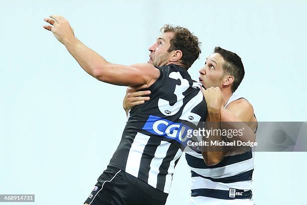 Travis Cloke of the Magpies and Harry Taylor of the Cats contest for the ball during the round one AFL NAB Cup match between the Geelong Cats and the...