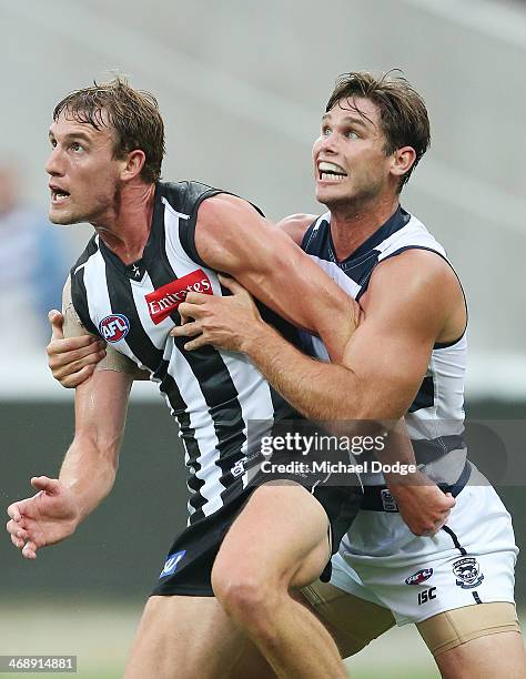 Lachlan Keeffe of the Magpies and Tom Hawkins of the Cats contest for the ball during the round one AFL NAB Cup match between the Geelong Cats and...