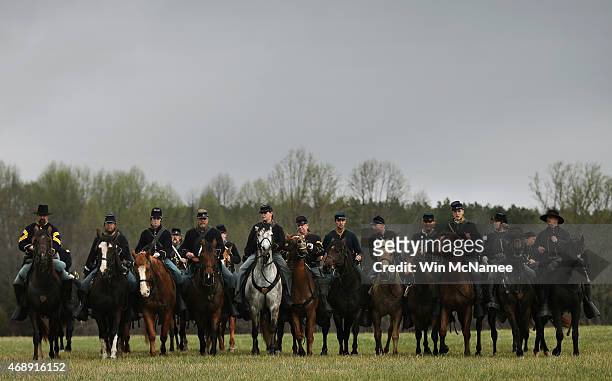 American Civil War re-enactors dressed as Union cavalry drill early in the morning at the Appomattox Court House National Historical Park April 8,...