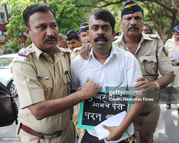 Activist Madan Darade with half shaved head protest outside Vidhan Bhavan demanding justice from Chief Minister on April 8, 2015 in Mumbai, India.